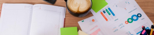 organizing on a desk with coffee and papers