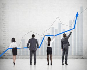 people holding up a graph