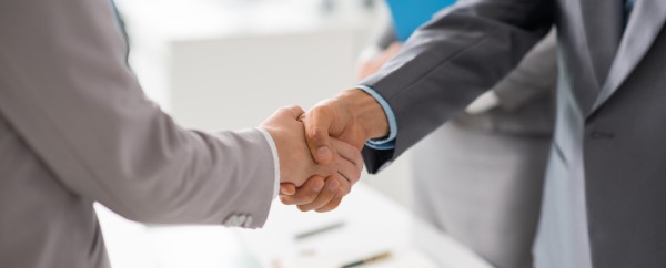 A physical handshake is still a powerful gesture.