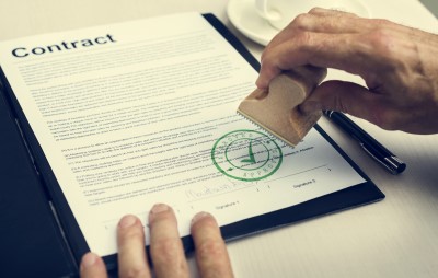A contract getting an approval stamp. Don't work on anything that the client has not officially approved of on either a signed contract or scope of work.